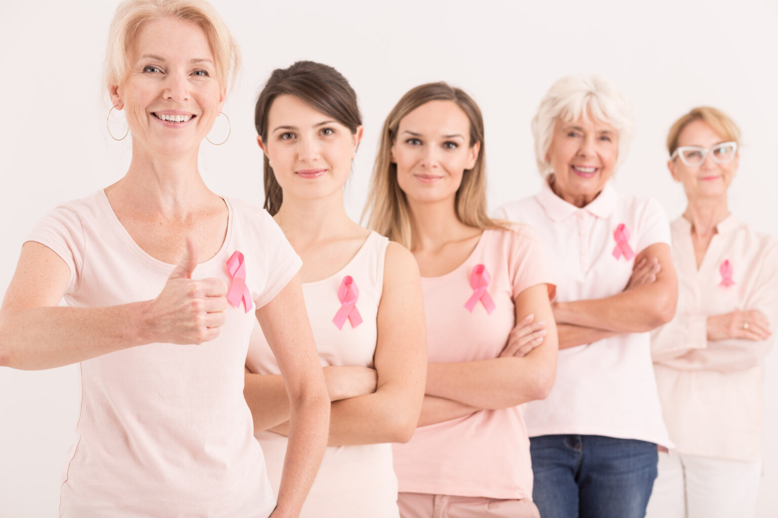 Multigenerational women with pink ribbons in breast cancer foundation